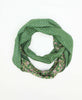 Deep green cotton circle scarf that has small flowers
