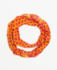 bright orange and red fair trade infinity scarf hand-made by a woman artisan using recycled vintage cotton saris