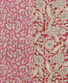 pink and red infinity scarf with beige swirling intricate floral and paisley patterns stitched with neon yellow thread