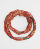 red and beige cotton infinity scarf with green accents and white kantha stitching 
