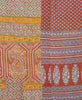 brick red, blue and green kantha quilt made by handstitching layers of vintage cotton saris together