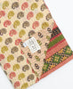 ethically made kantha quilt with artisan maker's name right on the tag
