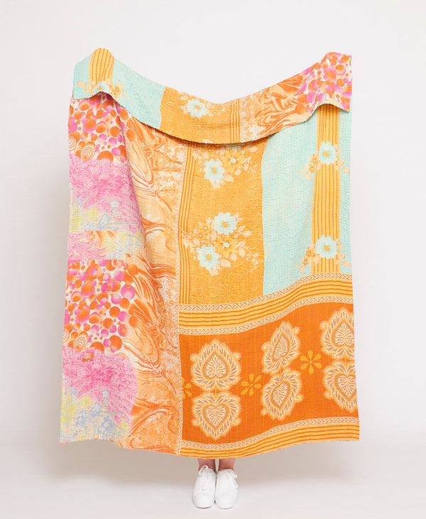Handmade large throw quilt crafted using upcycled vintage saris 