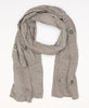 Grey colored sustainable cotton scarf that has geometric and floral designs 