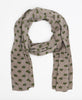 Geometric printed cotton light brown scarf that has small green flowers as accents