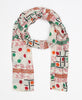 White cotton scarf that has a colorful design printed on top of vintage fabric