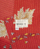 One-of-a-kind quilt throw featuring the hand-stitched signature of the maker 