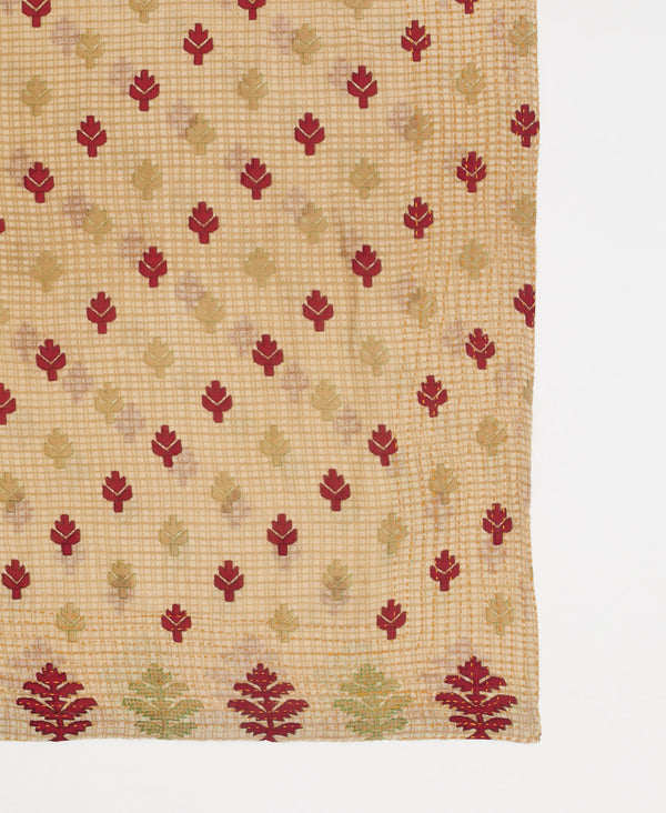 Beige artisan-made bandana featuring a small red leaf print  and traditional kantha stitching 