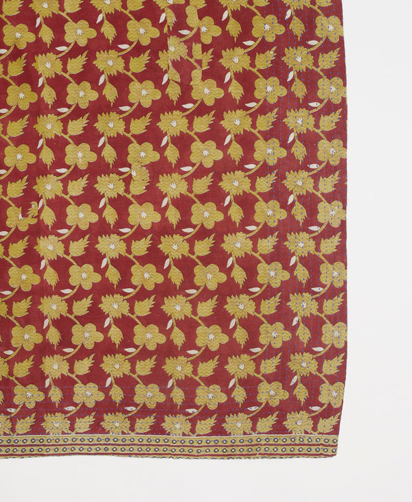 Burgundy artisan made bandana featuring a beige and white floral print and traditional kantha stitching 