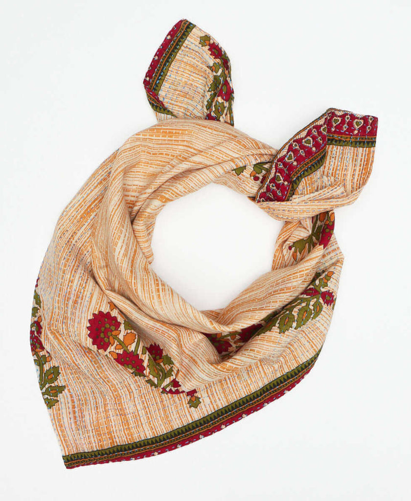 Tan striped cotton oversized scarf that has red and green floral patterns with traditional stitch work