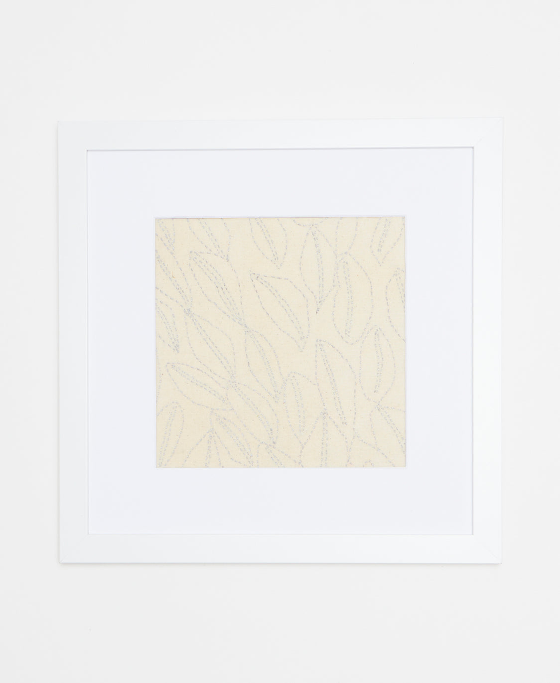 Handcrafted artisan-made textile art featuring light blue sitching that forms a coffee bean or leaf pattern 