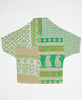 Green and pink floral and paisley print artisan-made cocoon jacket featruing Kantha stitching 