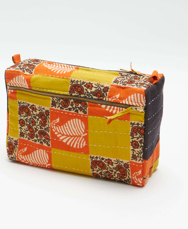 Fall color inspired patchwork large toiletry bag that has paisley and leaf patterned detailing 