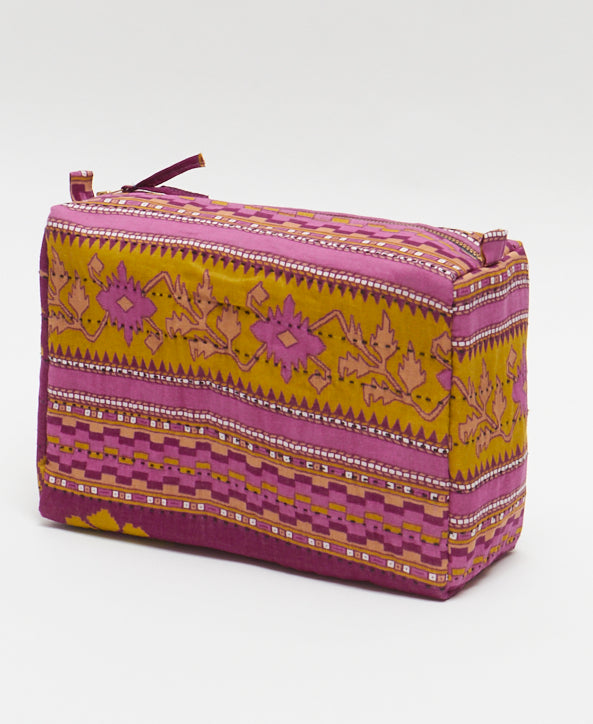 Features pull tabs and zipper tabs for easy access makes for the perfect travel bag made from ecofriendly material that was handcrafted by a female artisan from Ajmer, India