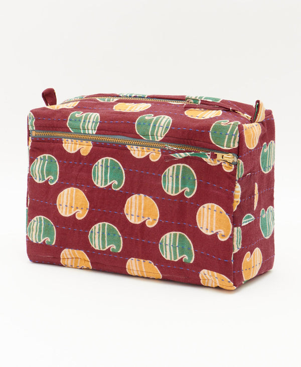 handmade brick red toiletry bag with green and yellow oversized paisley print by Anchal