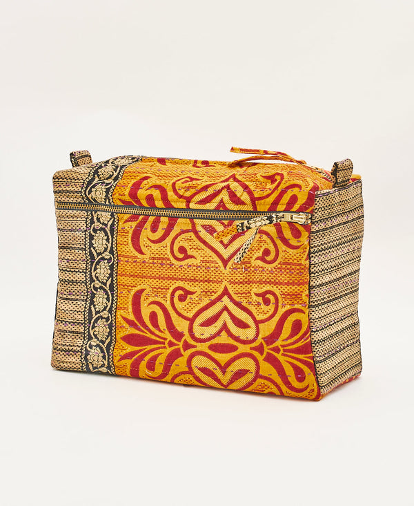 Bold red, organge, black and brown toiletry bag featuring purple traditional kantha hand stitching 