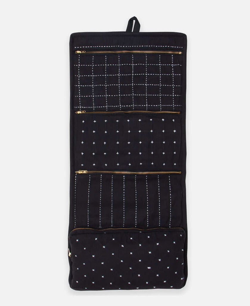 large hanging and folding travel organizer in charcoal black with hand-stitched embroidery