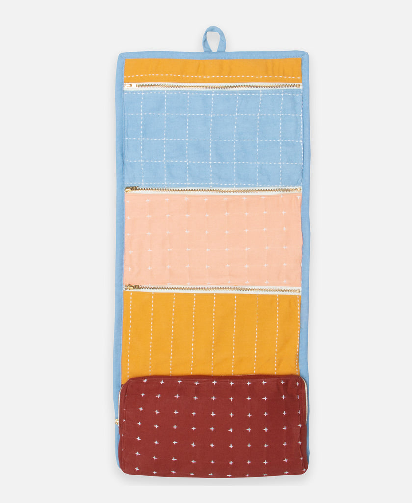 hanging colorblock toiletry organizer in sky blue, mustard yellow, rust and peach by Anchal Project