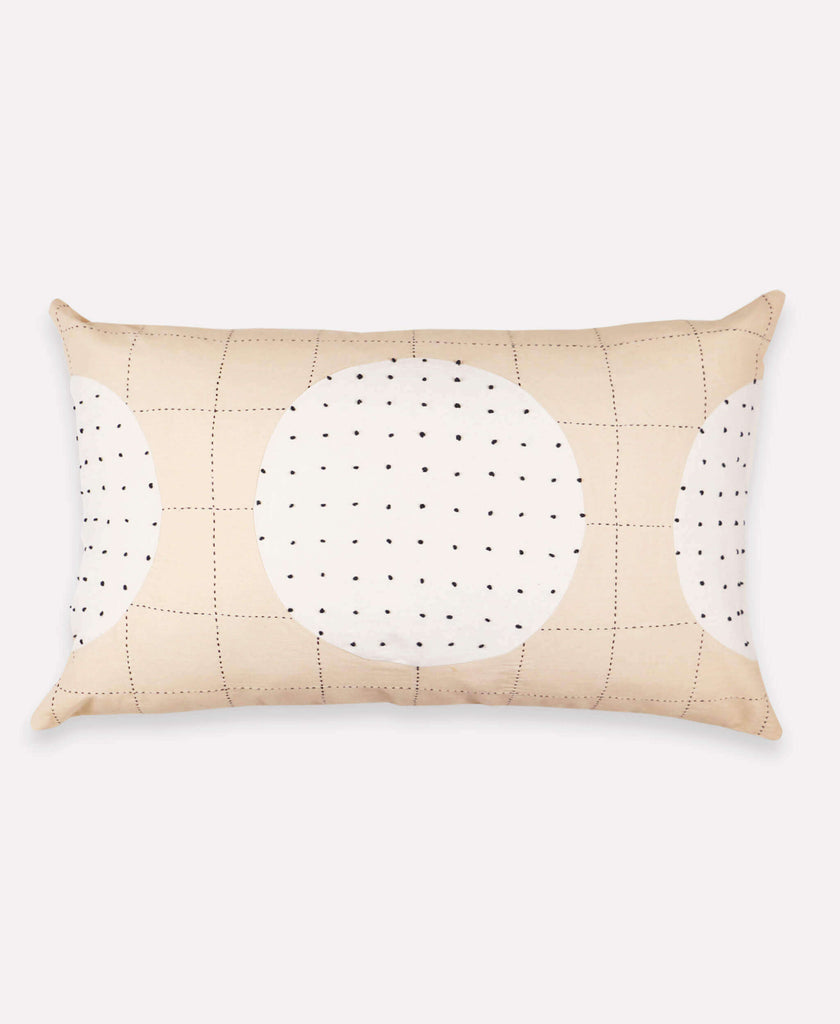 Handmade lumbar pillow with neutral, two-tone concentric pattern