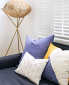 Anchal Project sustainable pillow arrangement in blue white and mustard tones