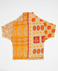Orange, mustard and brown paosley print artisan-made cocoon jacket featruing Kantha stitching 