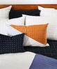 naari colorblock lumbar pillow on naari quilt throw with black and white pillows