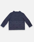 collared organic cotton jacket with hand-embroidered geometric pattern