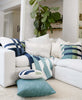 all white couch in living room with fiddle leaf fig featuring blue and green throw pillows