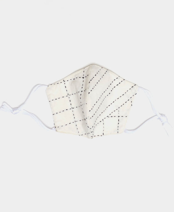 White face mask with two layers of cotton handstitched by Anchal artisans in Ajmer India