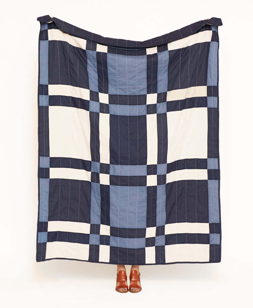 modern plaid quilt made from organic cotton by artisans in India