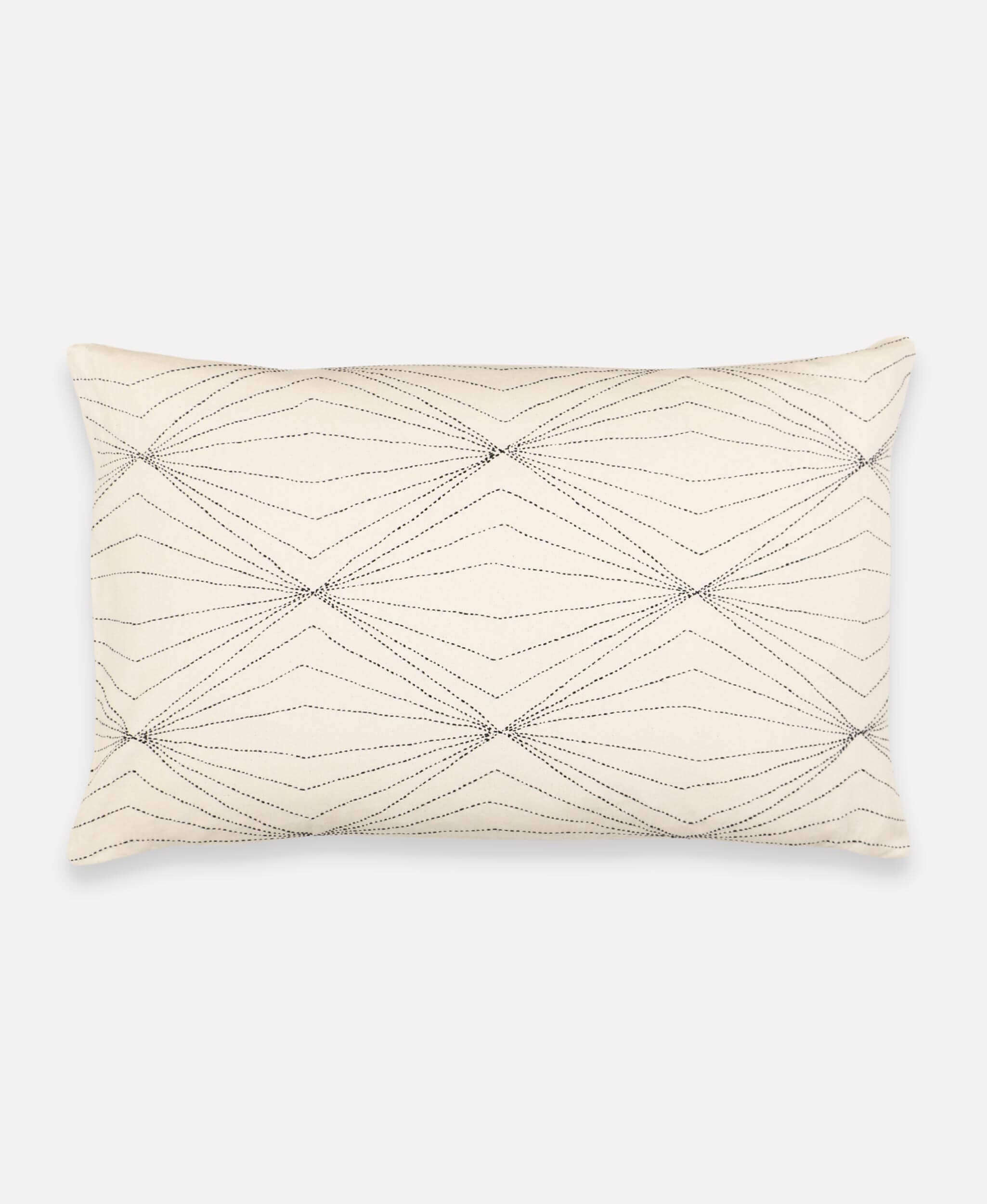 ivory lumbar pillow with hand-stitched diamond wave design