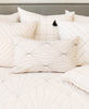 all ivory throw pillows with mismatched embroidery patterns handmade in India by all women artisans