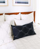 white and black grid bedding with black prism lumbar pillow