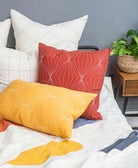 mustard yellow prism lumbar pillow on modern bed