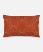 rust lumbar pillow made with organic cotton and hand embroidered by anchal artisan