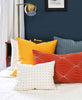 bright, colorful throw pillows in playful modern bedroom by Anchal Project