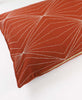 hand-stitched orange throw pillow using modern kantha stitching