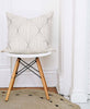 artistic modern throw pillow in white mid-century modern chair