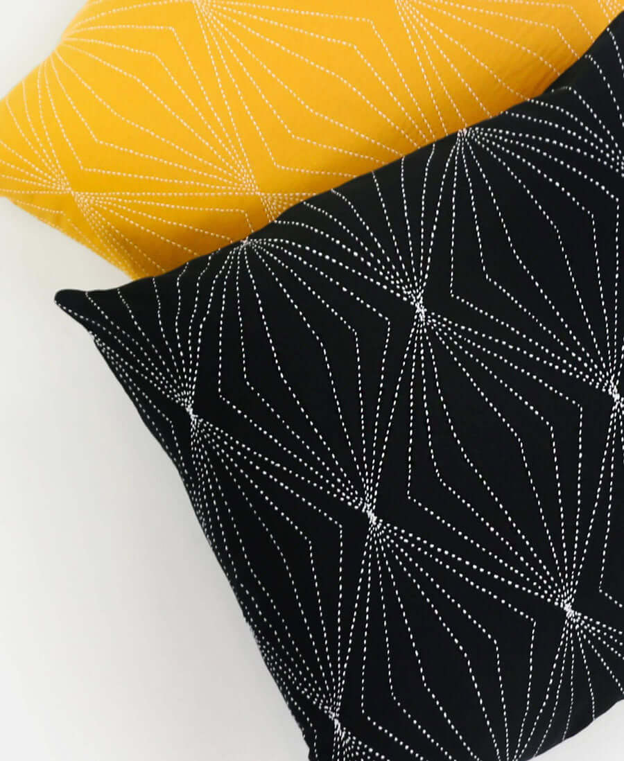 organic cotton black accent pillow with geometric embroidery hand-stitched by Anchal artisans