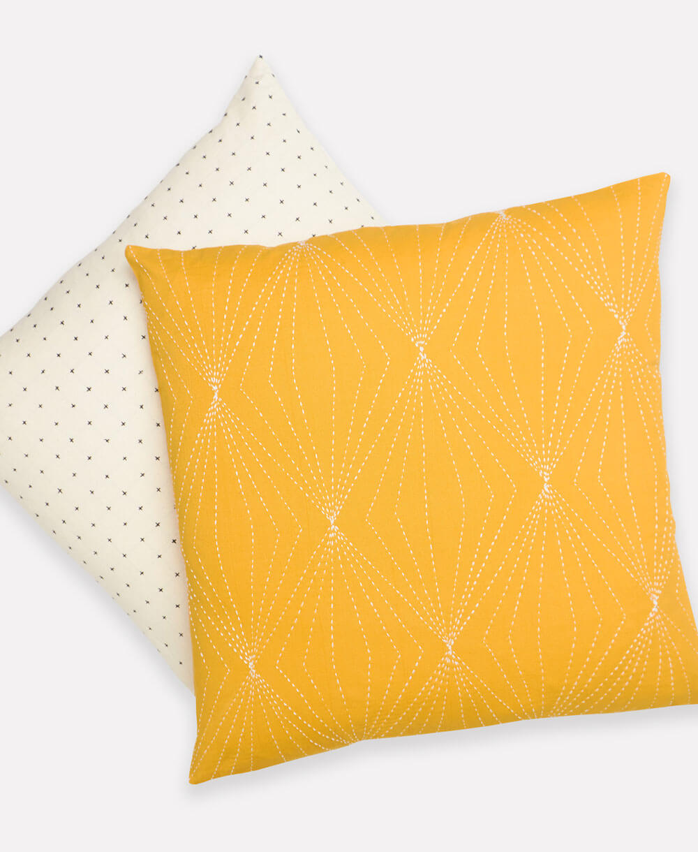 coordinating organic cotton ethically produced throw pillow with hand embroidery