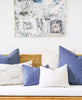 blue and white minimalist pillow arrangement on a couch in a modern home