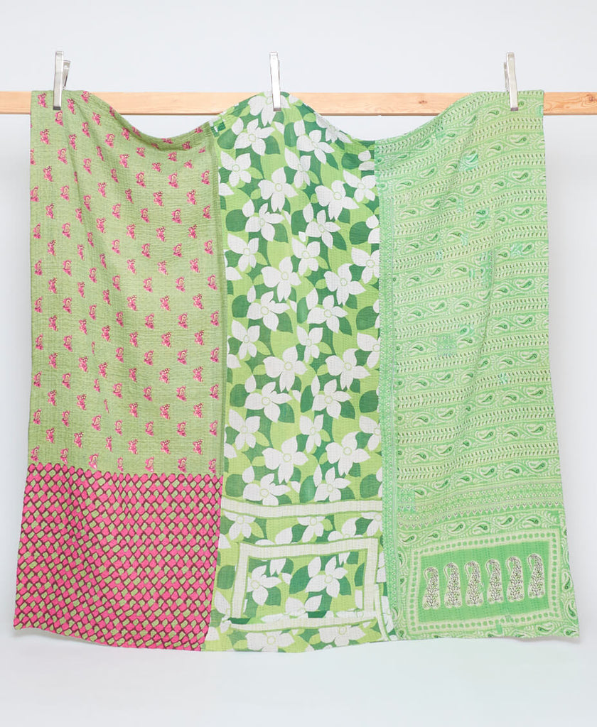 bright pastel green queen kantha quilt made with care by women artisans in India