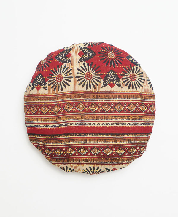 Red, brown, and tan round vintage kantha throw pillow featuring an intricate pattern through out 