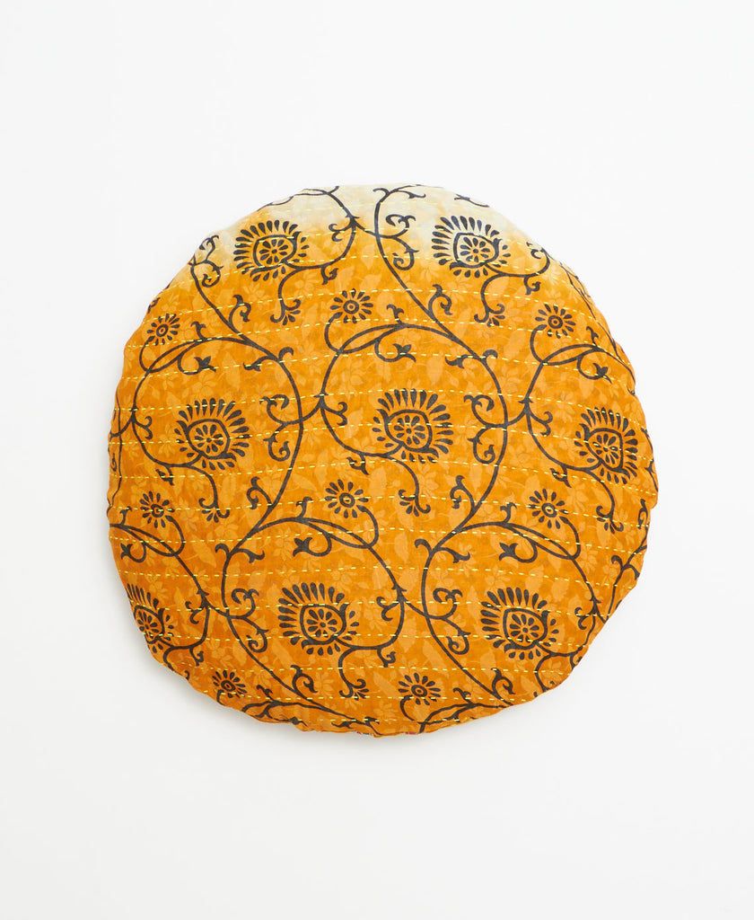 White to orange ombre round vintage kantha throw pillow with an intricate black pattern through out 