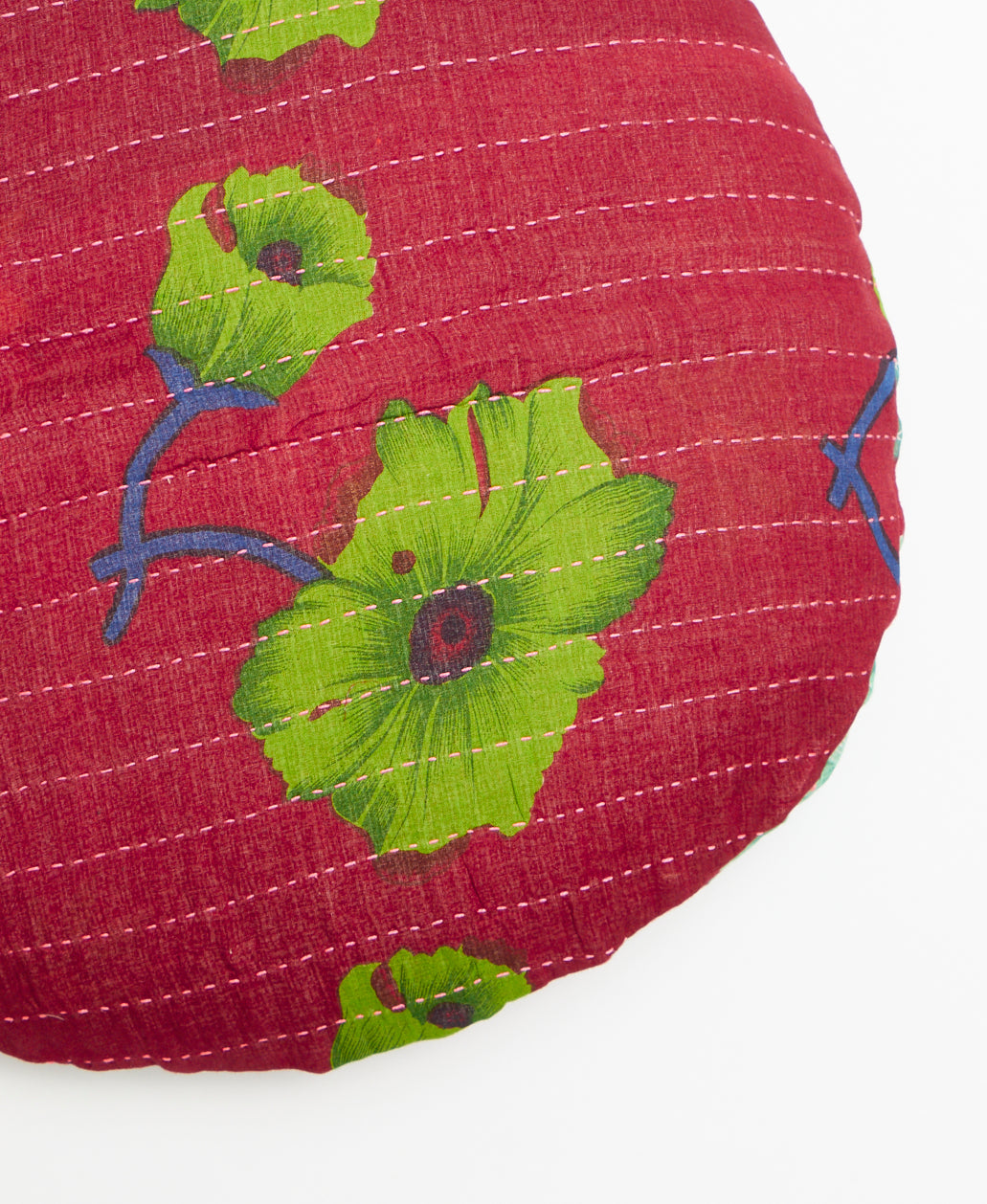 Handcrafted round throw pillow featuring kantha stitching 