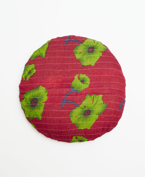Burgundy round vintage kantha throw pillow with a large green floral print through out 