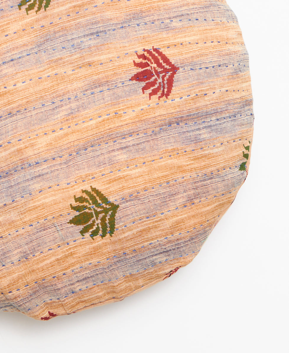 Handcrafted round throw pillow featuring kantha stitching 