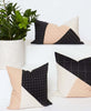 black and white coordinating pillow arrangement with geometric patterns for the modern home