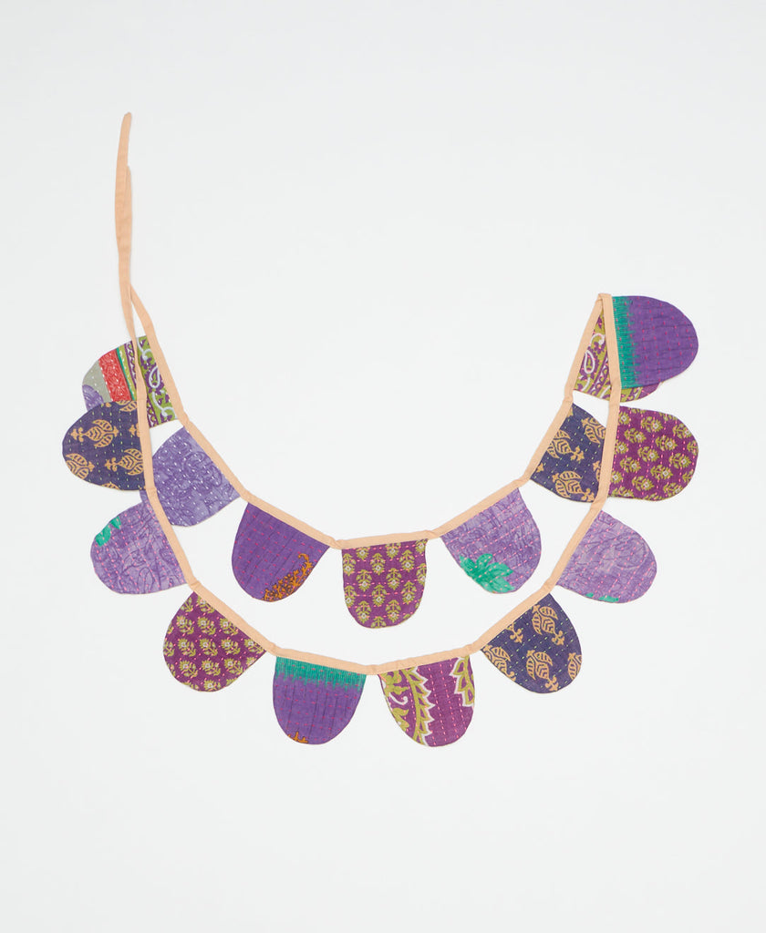 handmade fabric scalloped garland in various hues of purple by Anchal Project