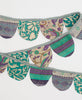 one-of-a-kind reusable holiday garland made of scraps of recycled vintage saris